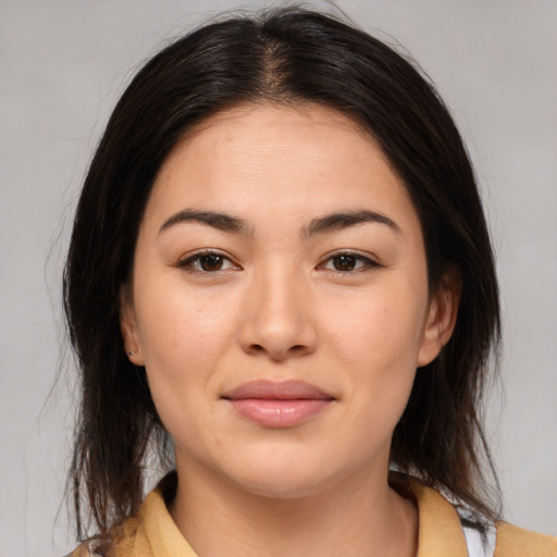 Joyful asian young-adult female with medium  brown hair and brown eyes