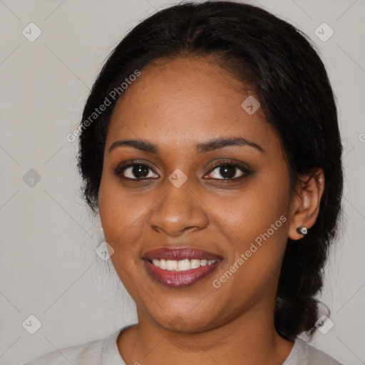 Joyful black young-adult female with medium  black hair and brown eyes