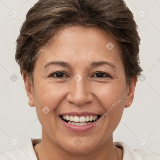 Joyful white adult female with short  brown hair and brown eyes