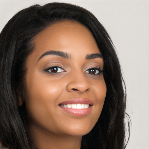 Joyful latino young-adult female with long  black hair and brown eyes