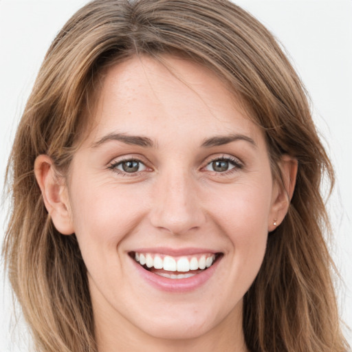 Joyful white young-adult female with long  brown hair and green eyes