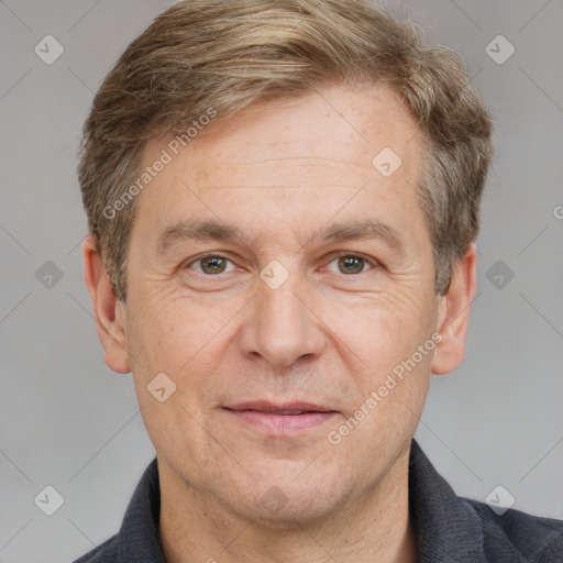 Joyful white adult male with short  brown hair and grey eyes