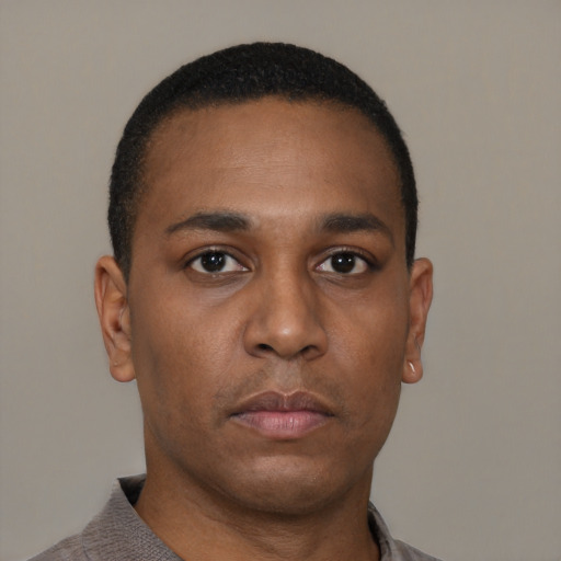 Neutral black young-adult male with short  brown hair and brown eyes