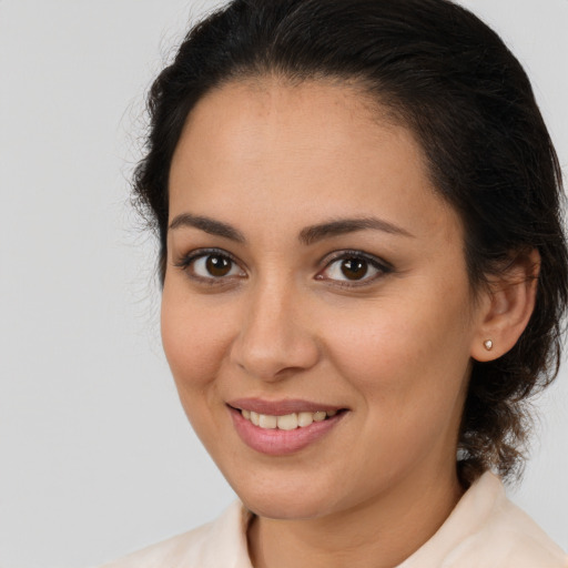 Joyful white young-adult female with medium  brown hair and brown eyes