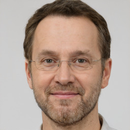 Joyful white adult male with short  brown hair and grey eyes