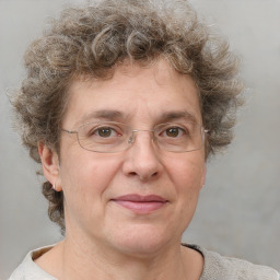 Joyful white adult male with short  brown hair and grey eyes