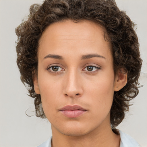 Neutral white young-adult female with short  brown hair and brown eyes