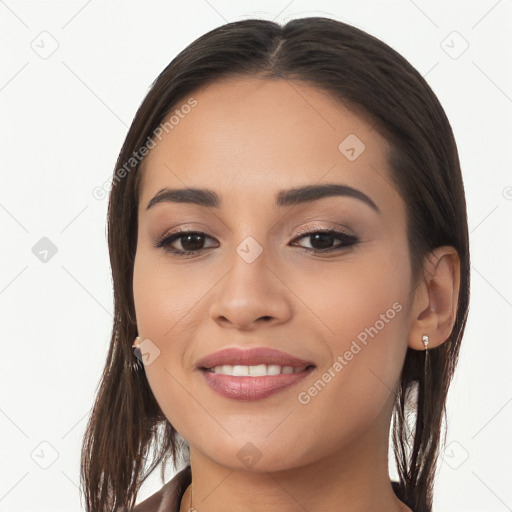 Joyful white young-adult female with long  brown hair and brown eyes