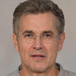 Joyful white middle-aged male with short  brown hair and brown eyes