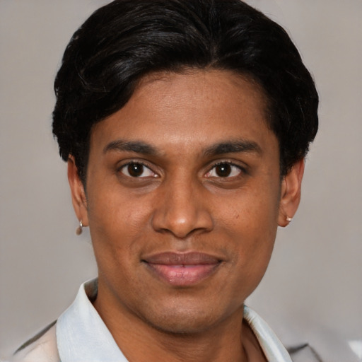 Joyful asian young-adult male with short  black hair and brown eyes
