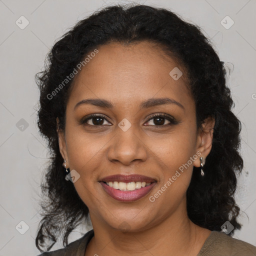 Joyful black young-adult female with long  brown hair and brown eyes