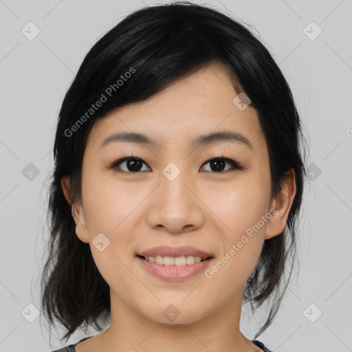 Joyful asian young-adult female with medium  black hair and brown eyes