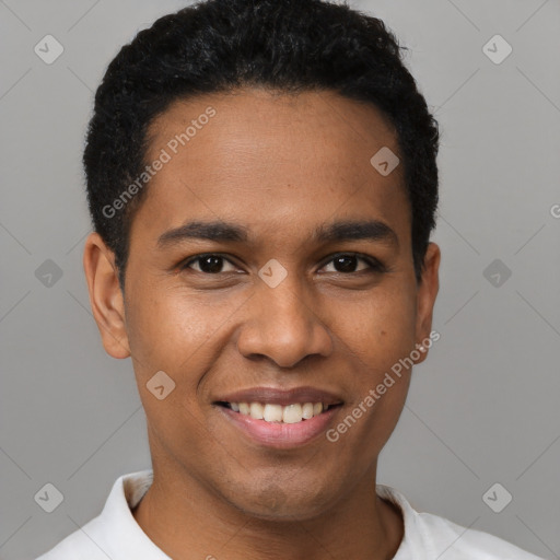 Joyful latino young-adult male with short  black hair and brown eyes