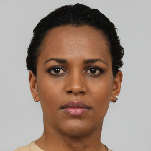 Neutral black young-adult female with short  black hair and brown eyes