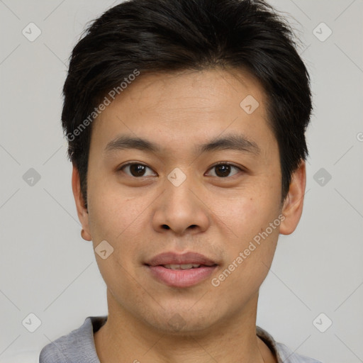 Joyful asian young-adult male with short  brown hair and brown eyes