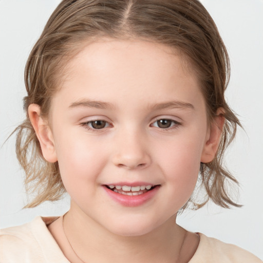 Joyful white child female with medium  brown hair and grey eyes