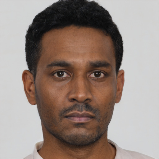 Neutral black young-adult male with short  black hair and brown eyes
