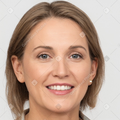 Joyful white adult female with medium  brown hair and grey eyes