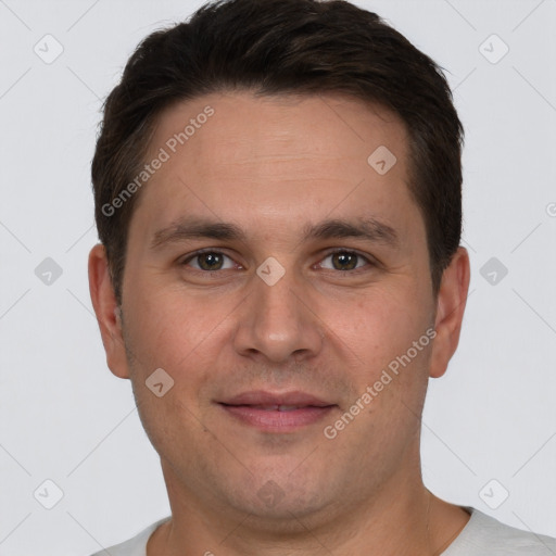 Joyful white young-adult male with short  brown hair and brown eyes