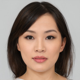 Neutral asian young-adult female with medium  brown hair and brown eyes