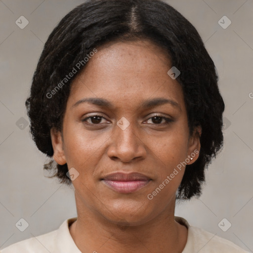 Joyful black adult female with short  brown hair and brown eyes