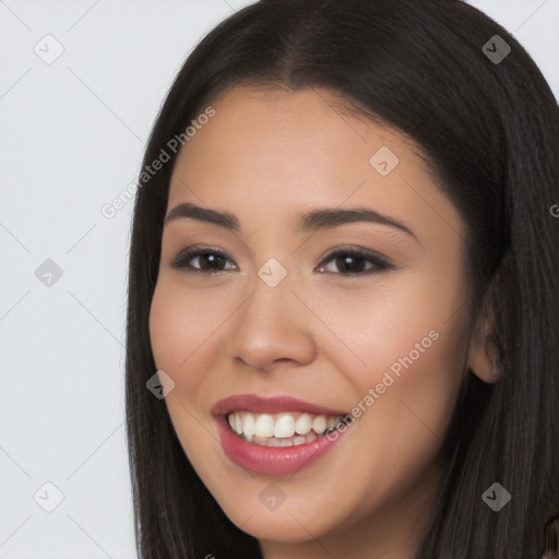 Joyful latino young-adult female with long  brown hair and brown eyes