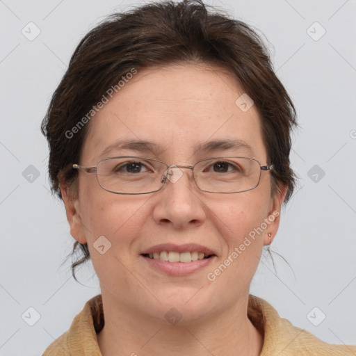 Joyful white adult female with medium  brown hair and grey eyes