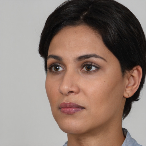 Neutral asian young-adult female with medium  black hair and brown eyes