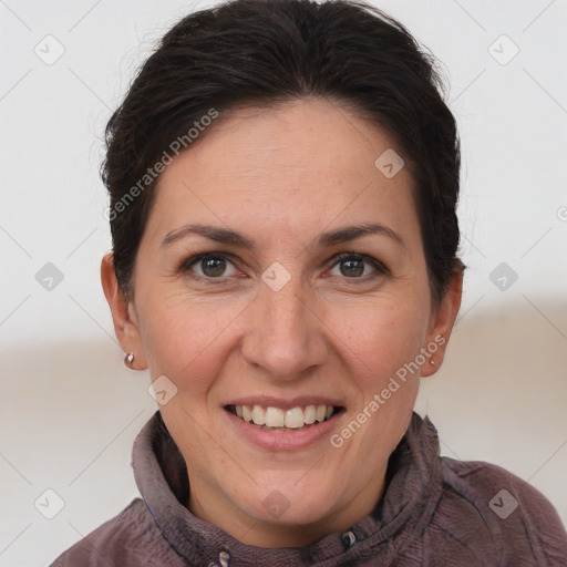 Joyful white adult female with short  brown hair and brown eyes