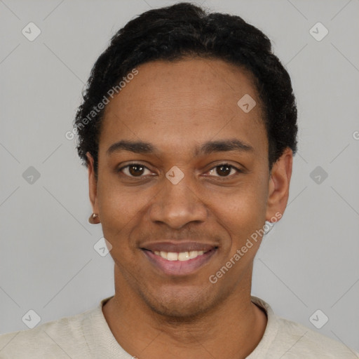 Joyful black young-adult male with short  black hair and brown eyes