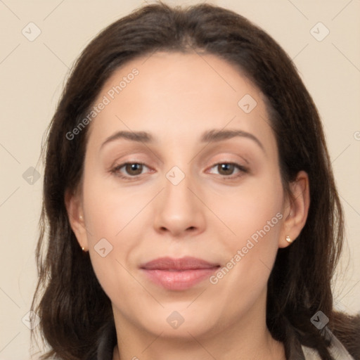 Joyful white young-adult female with long  brown hair and brown eyes