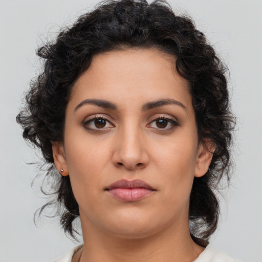 Neutral latino young-adult female with medium  brown hair and brown eyes