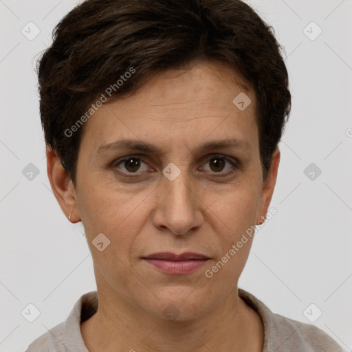 Joyful white adult female with short  brown hair and brown eyes