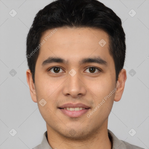 Joyful latino young-adult male with short  black hair and brown eyes