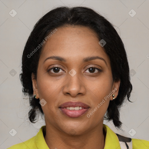 Joyful black adult female with medium  brown hair and brown eyes