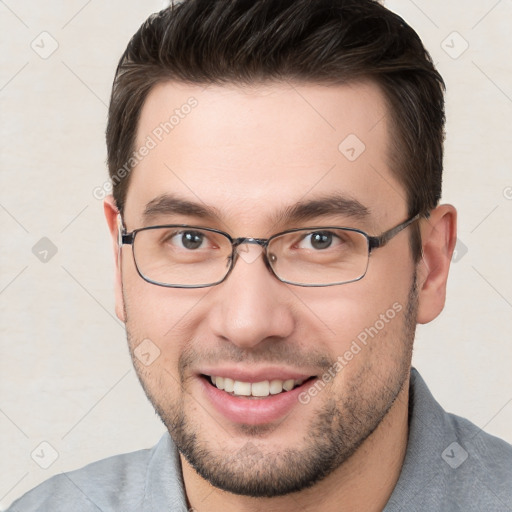 Joyful white young-adult male with short  brown hair and brown eyes