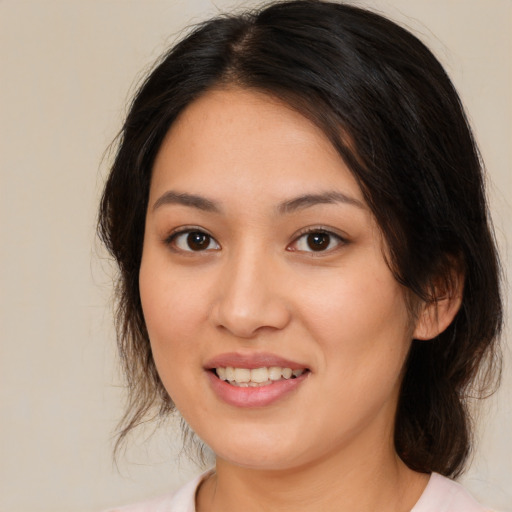 Joyful white young-adult female with medium  brown hair and brown eyes