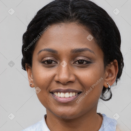 Joyful black young-adult female with medium  brown hair and brown eyes