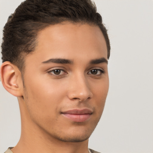 Joyful latino young-adult male with short  brown hair and brown eyes