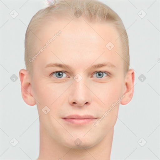 Joyful white young-adult male with short  brown hair and blue eyes