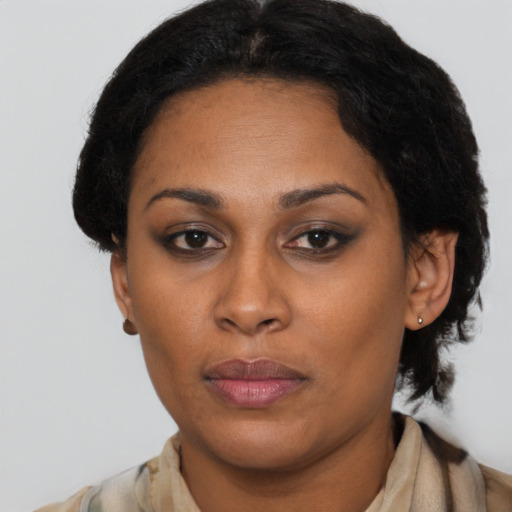 Neutral latino adult female with short  brown hair and brown eyes
