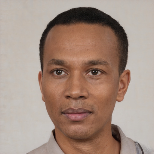 Neutral black adult male with short  black hair and brown eyes
