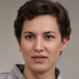 Joyful white adult female with short  brown hair and brown eyes