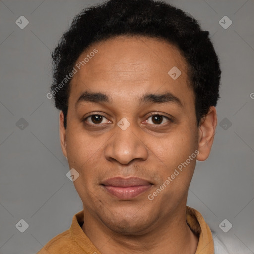 Joyful latino adult male with short  black hair and brown eyes