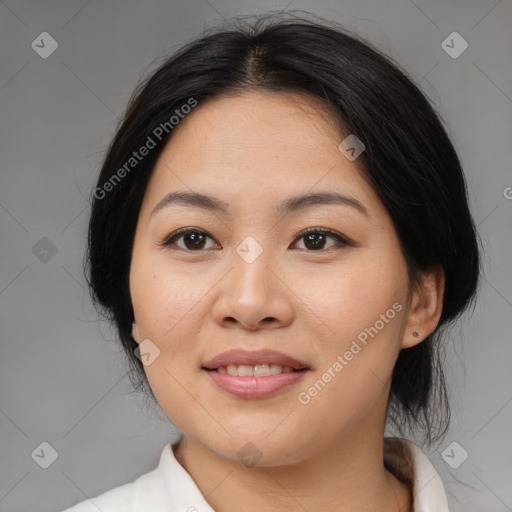 Joyful asian young-adult female with medium  black hair and brown eyes