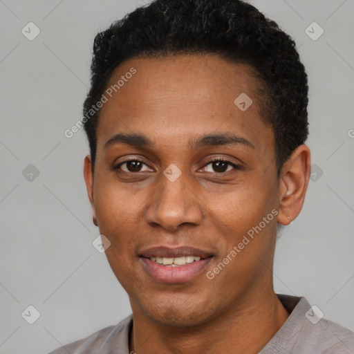 Joyful black young-adult male with short  black hair and brown eyes