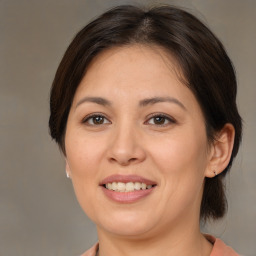 Joyful white adult female with medium  brown hair and brown eyes