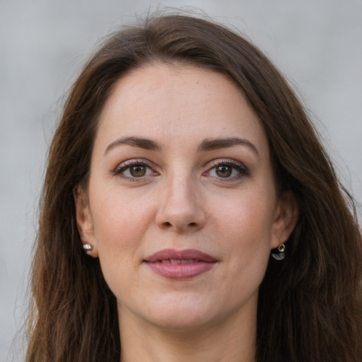 Joyful white young-adult female with long  brown hair and grey eyes