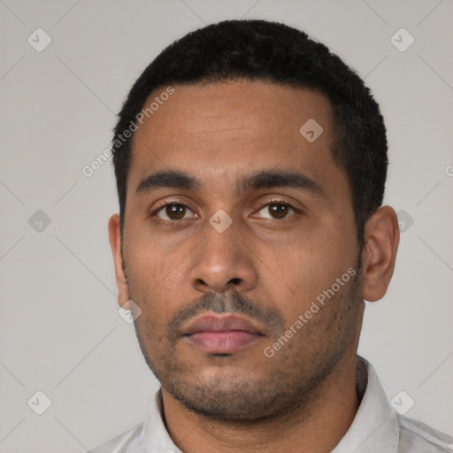 Neutral latino young-adult male with short  black hair and brown eyes