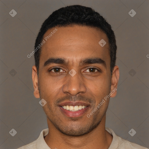 Joyful black young-adult male with short  black hair and brown eyes